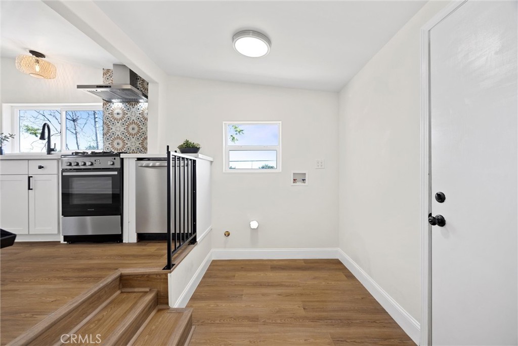 102 Jackson Street Taft, CA 93268 - Photo 14 of 34 a view of a kitchen with refrigerator and cabinets