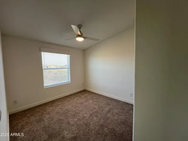 an empty room with a empty space and a window