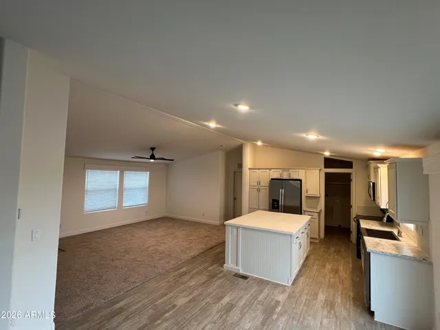 a large living room with a couch and a stove top oven