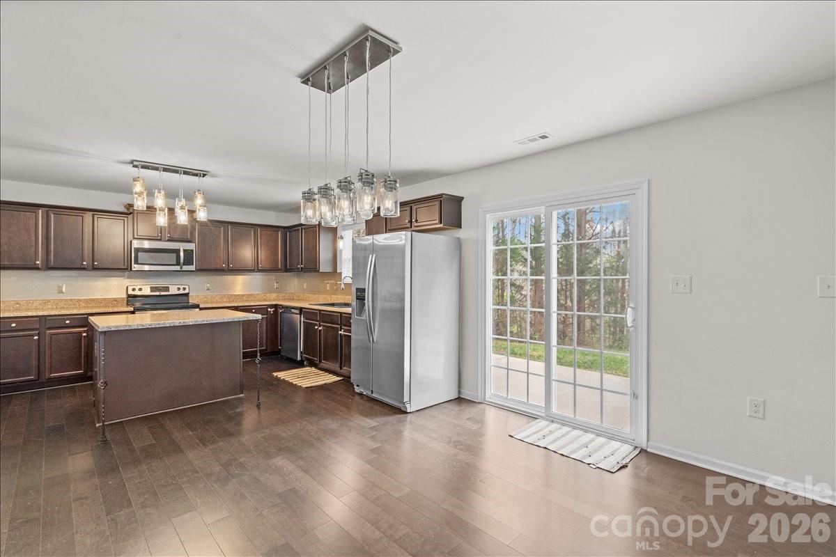 6066 Benedict Place, Unit 32 Fort Mill, SC 29707 - Photo 11 of 32 a large kitchen with a lot of counter space and stainless steel appliances
