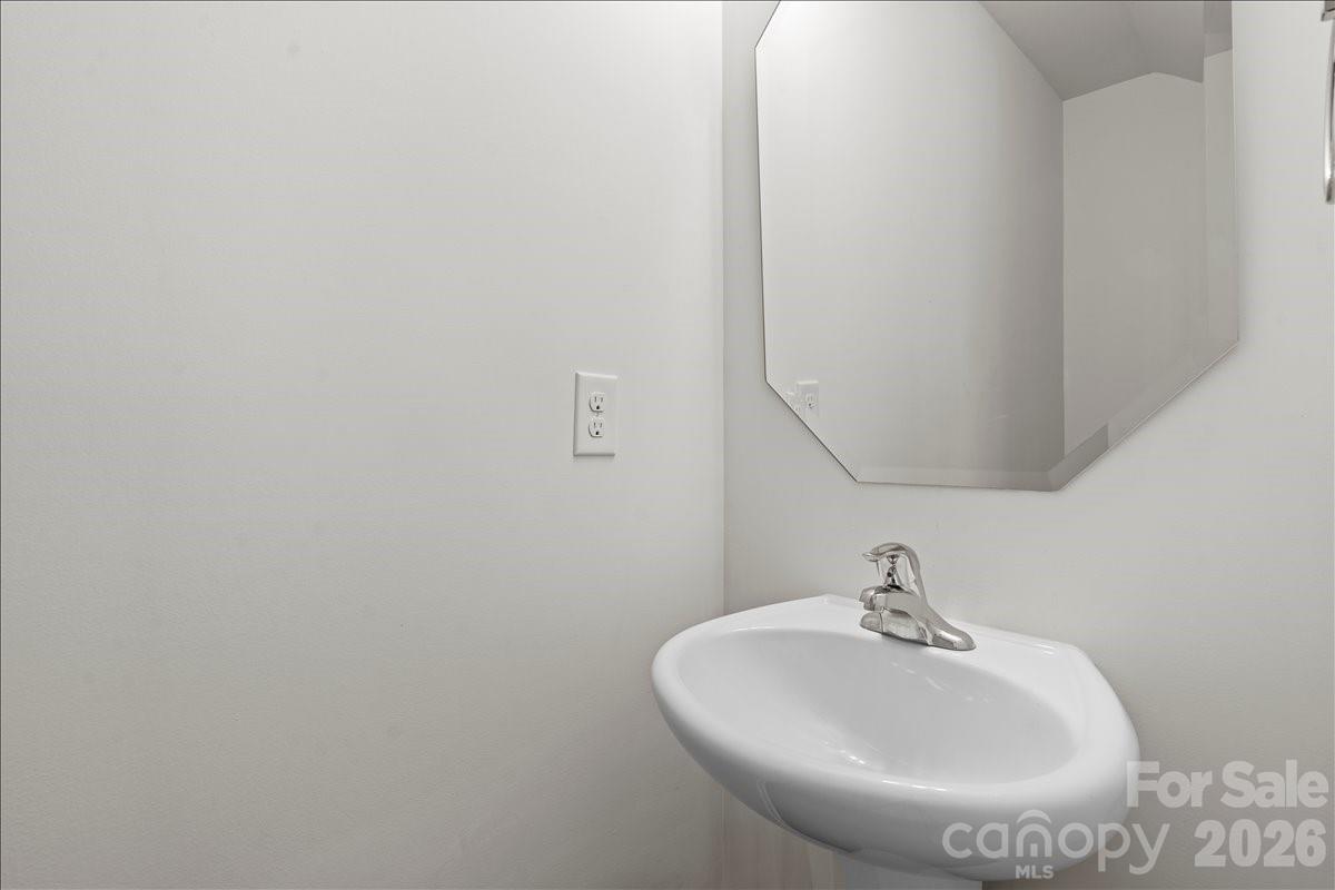 6066 Benedict Place, Unit 32 Fort Mill, SC 29707 - Photo 14 of 32 a bathroom with a sink and mirror