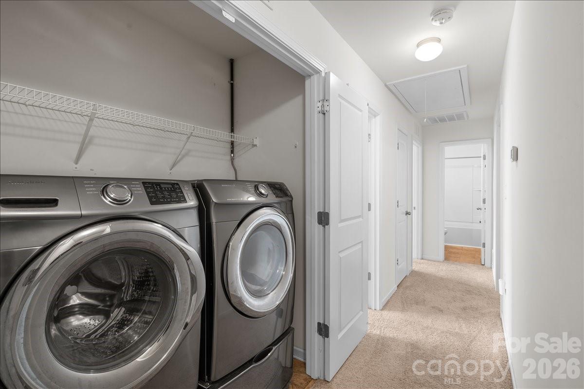 6066 Benedict Place, Unit 32 Fort Mill, SC 29707 - Photo 19 of 32 a view of a hallway with washer and dryer