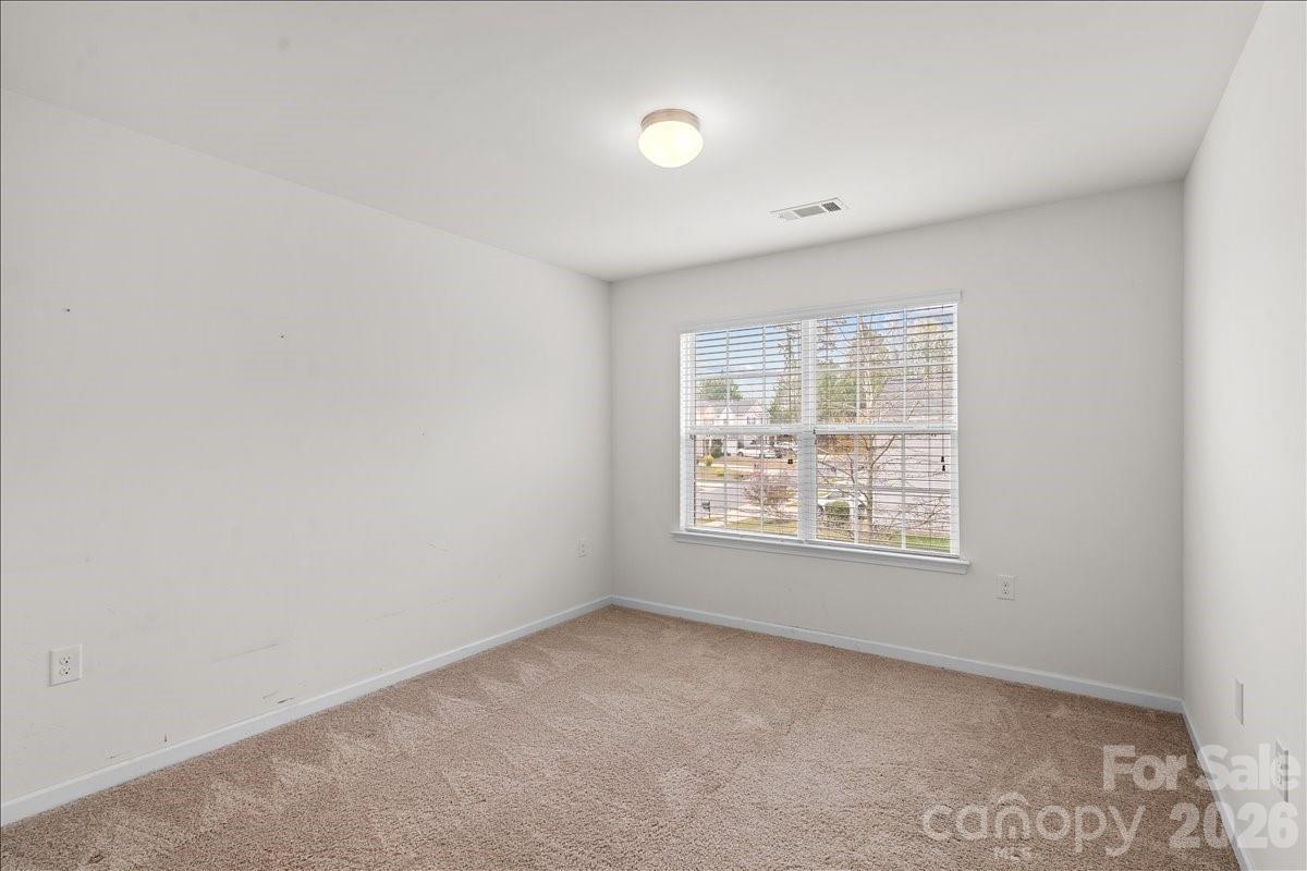 6066 Benedict Place, Unit 32 Fort Mill, SC 29707 - Photo 21 of 32 an empty room with a window