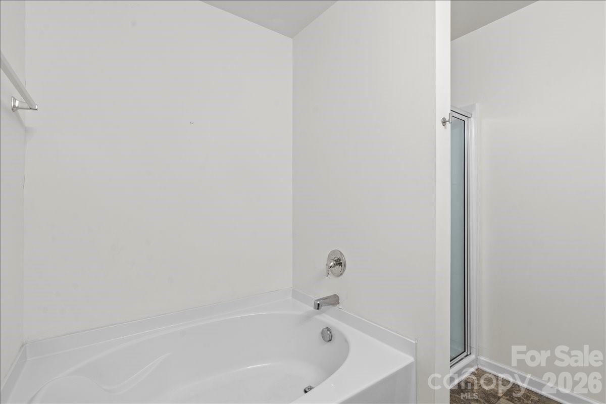 6066 Benedict Place, Unit 32 Fort Mill, SC 29707 - Photo 24 of 32 a bathroom with a tub