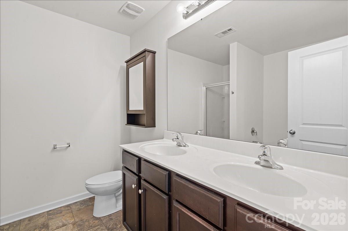 6066 Benedict Place, Unit 32 Fort Mill, SC 29707 - Photo 25 of 32 a bathroom with a sink and a toilet