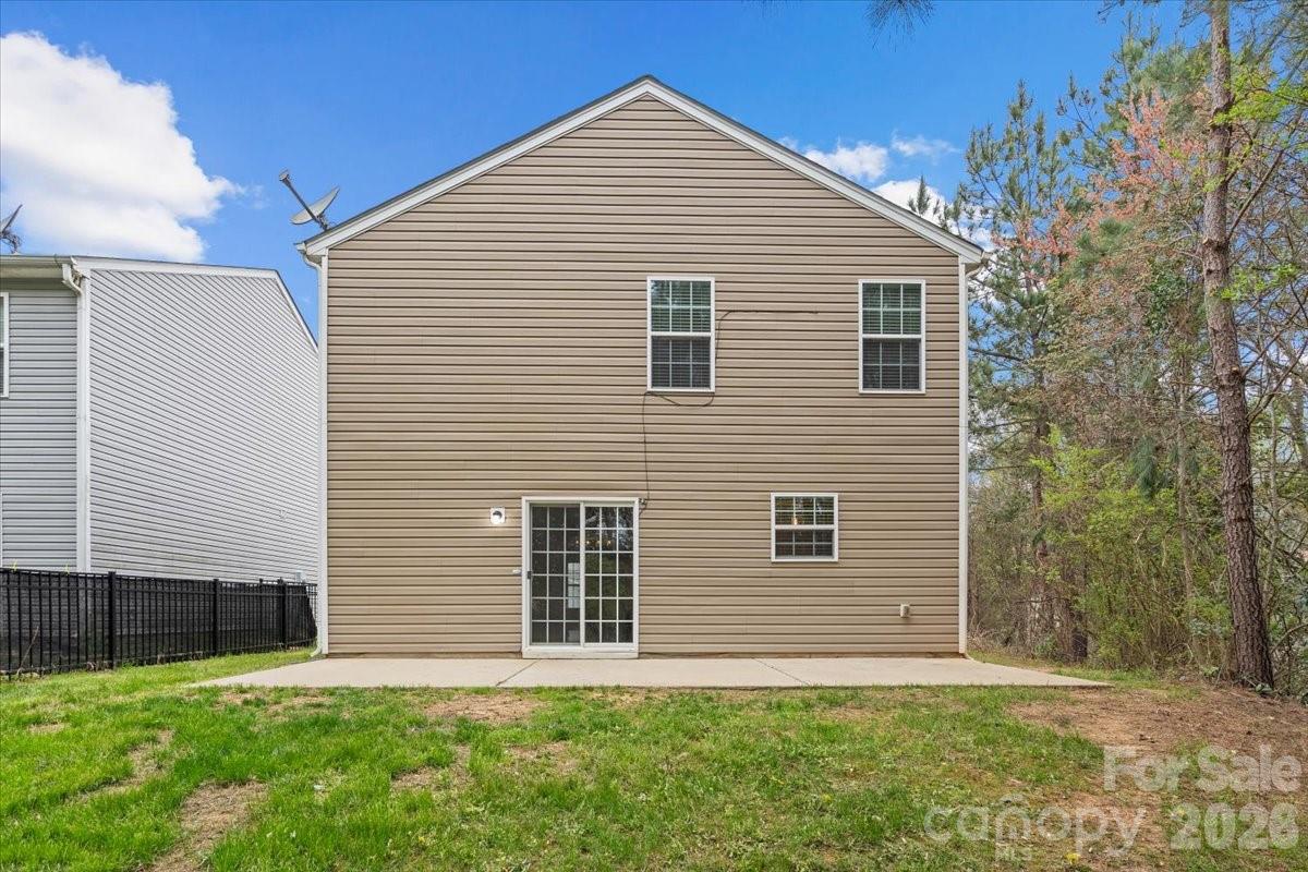 6066 Benedict Place, Unit 32 Fort Mill, SC 29707 - Photo 29 of 32 a front view of a house with a yard
