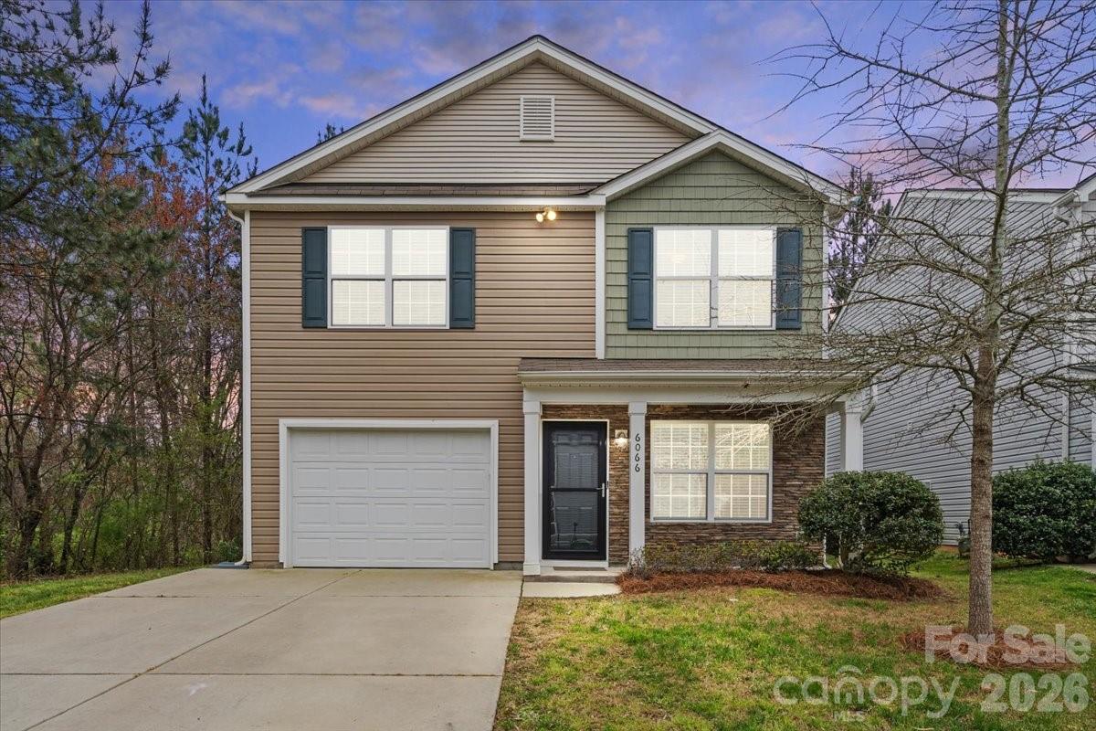 6066 Benedict Place, Unit 32 Fort Mill, SC 29707 - Photo 32 of 32 a front view of a house with garden