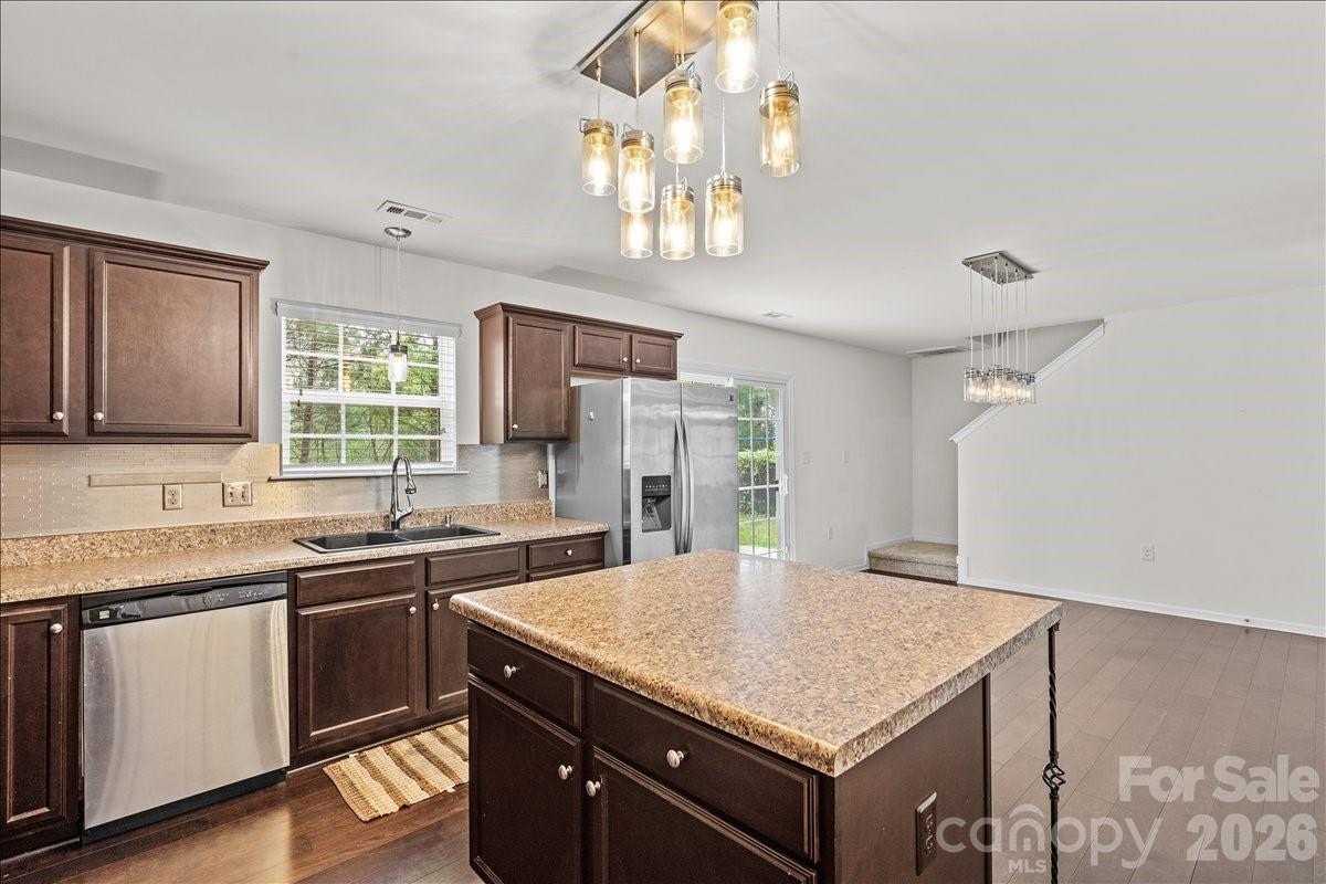 6066 Benedict Place, Unit 32 Fort Mill, SC 29707 - Photo 8 of 32 a kitchen with a sink a center island and cabinets