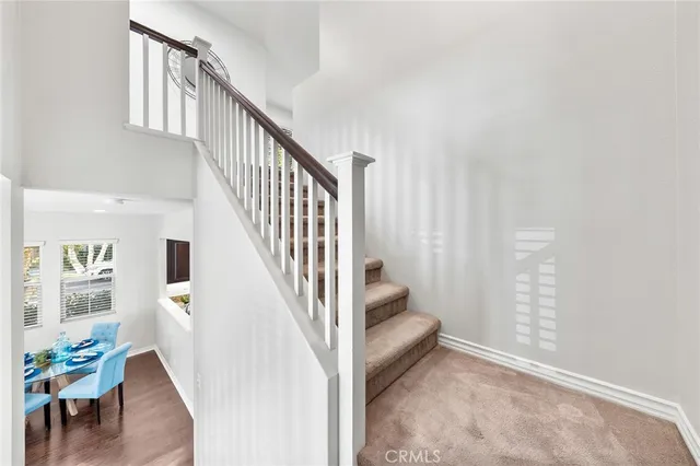 a view of entryway with wooden floor and stairs