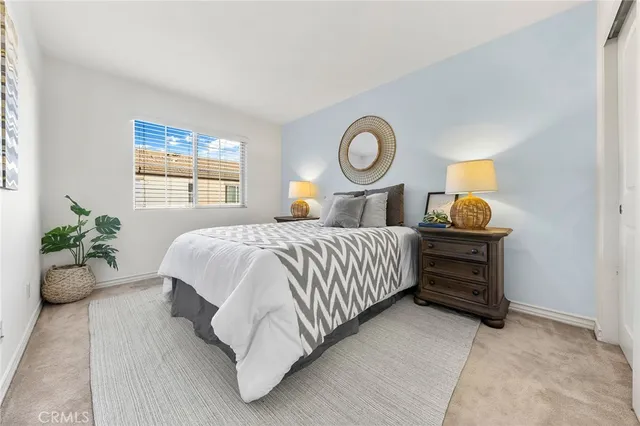 a bedroom with a bed and window