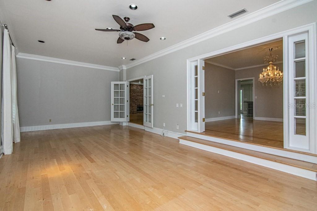 16405 Avila Boulevard Tampa, FL 33613 - Photo 14 of 61 a view of a livingroom with a ceiling fan and window