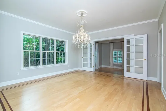 a view of kitchen with stainless steel appliances granite countertop a stove top oven a sink and a island