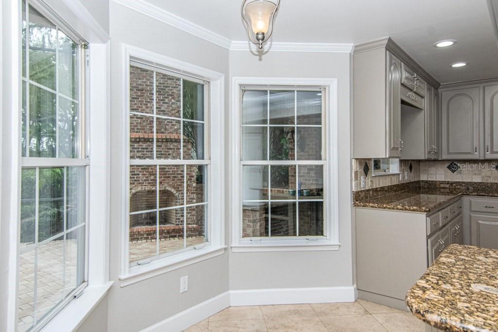 16405 Avila Boulevard Tampa, FL 33613 - Photo 22 of 61 a view of a kitchen with granite countertop cabinets and window