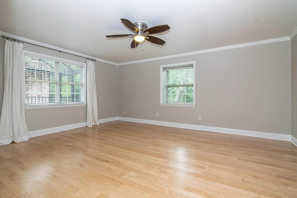 16405 Avila Boulevard Tampa, FL 33613 - Photo 24 of 61 a view of an empty room with wooden floor and a window