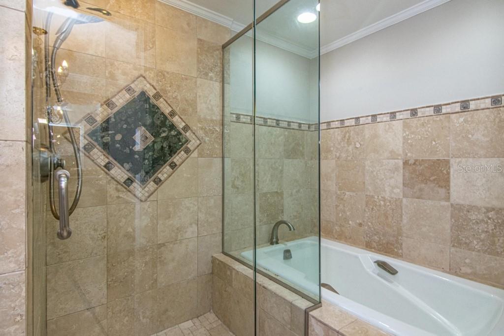 16405 Avila Boulevard Tampa, FL 33613 - Photo 30 of 61 a bathroom with a shower and a toilet