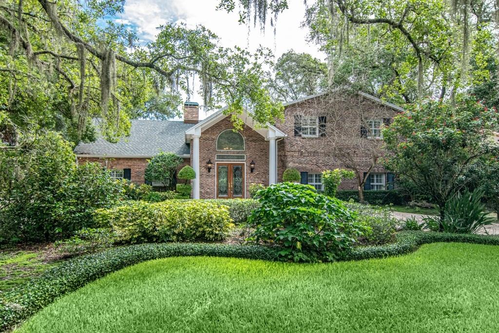 16405 Avila Boulevard Tampa, FL 33613 - Photo 3 of 61 a front view of a house with a yard