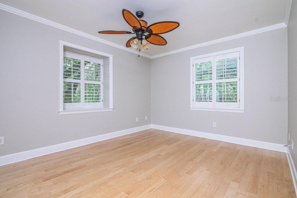 16405 Avila Boulevard Tampa, FL 33613 - Photo 35 of 61 wooden floor to ceiling window and an empty room