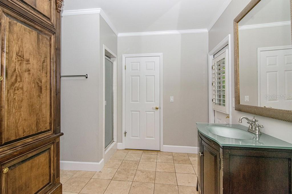 16405 Avila Boulevard Tampa, FL 33613 - Photo 36 of 61 a kitchen with a sink and a refrigerator