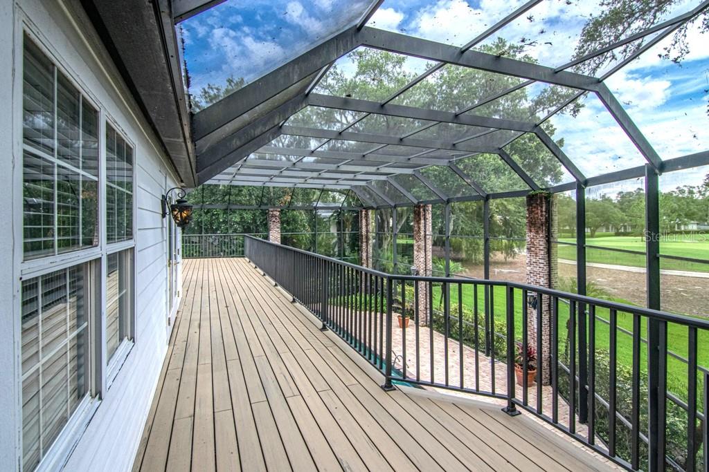 16405 Avila Boulevard Tampa, FL 33613 - Photo 42 of 61 a view of balcony with wooden floor