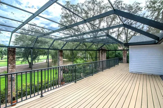 a view of house with backyard outdoor seating and hardwood
