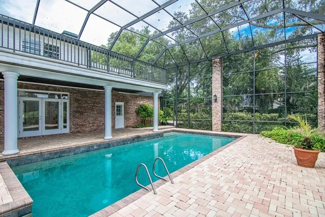 a view of a house with garden and a garden