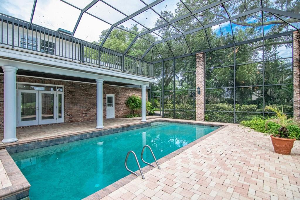16405 Avila Boulevard Tampa, FL 33613 - Photo 47 of 61 a view of a house with backyard porch and garden