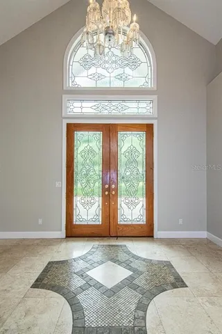 wooden floor in an empty room with a fireplace