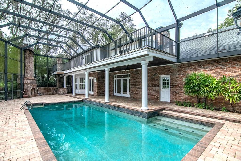 16405 Avila Boulevard Tampa, FL 33613 - Photo 52 of 61 a view of house with backyard outdoor seating and hardwood