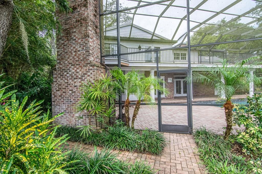 16405 Avila Boulevard Tampa, FL 33613 - Photo 54 of 61 a view of a house with a yard and sitting area