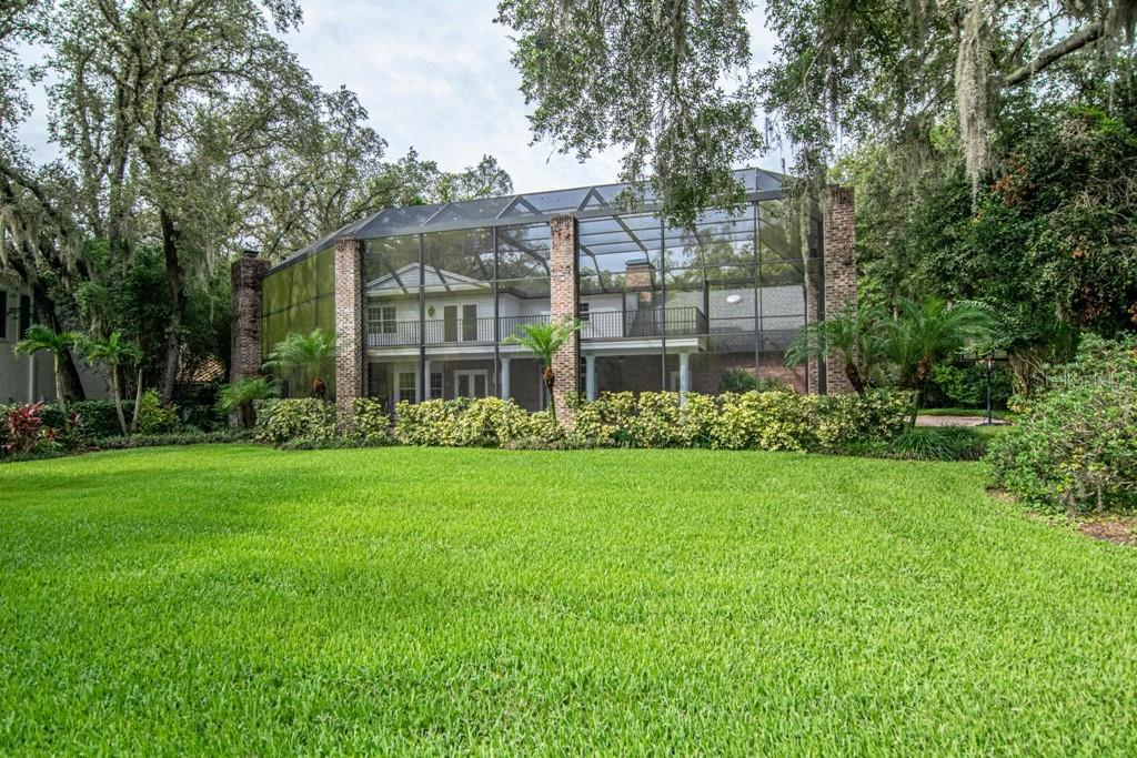 16405 Avila Boulevard Tampa, FL 33613 - Photo 57 of 61 front view of a house with a garden
