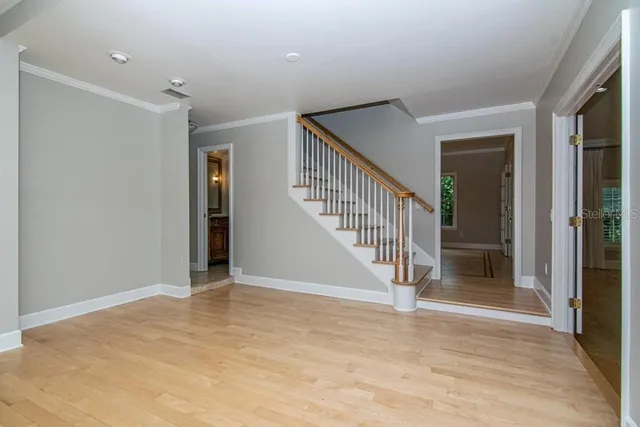 wooden floor fireplace and natural light in room