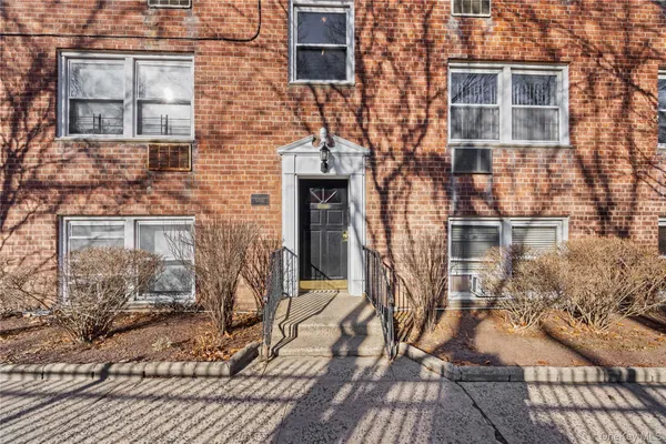 front view of a brick house with a door
