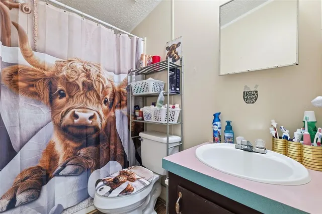 a view of a chairs and table on the balcony