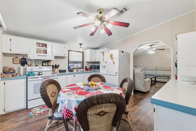 a bedroom with furniture and a chandelier