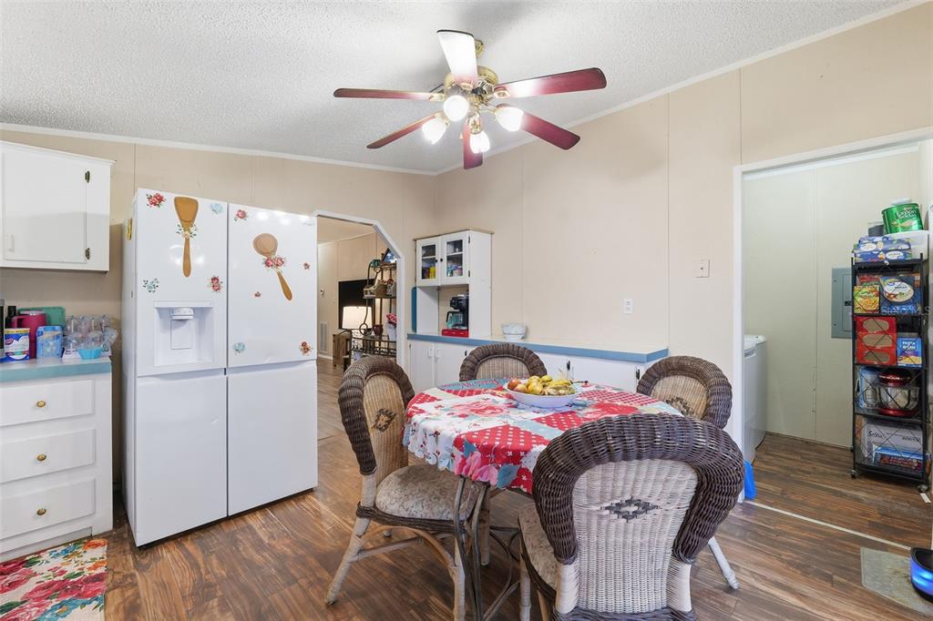 1890 Derosa Road Polk City, FL 33868 - Photo 9 of 20 a bedroom with furniture and a window
