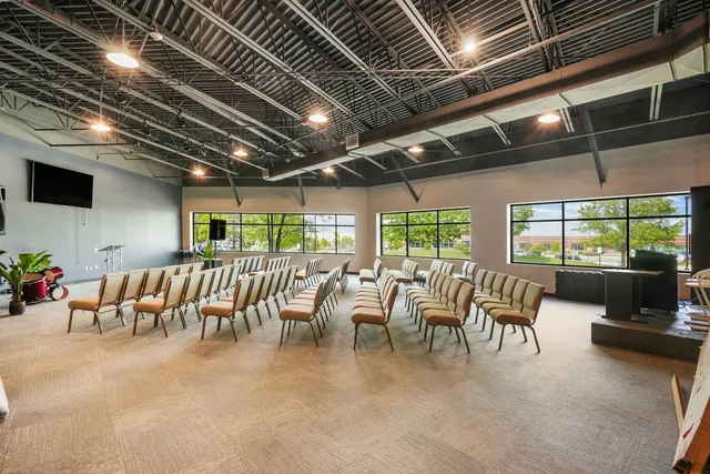 a living room with lots of furniture and a chandelier