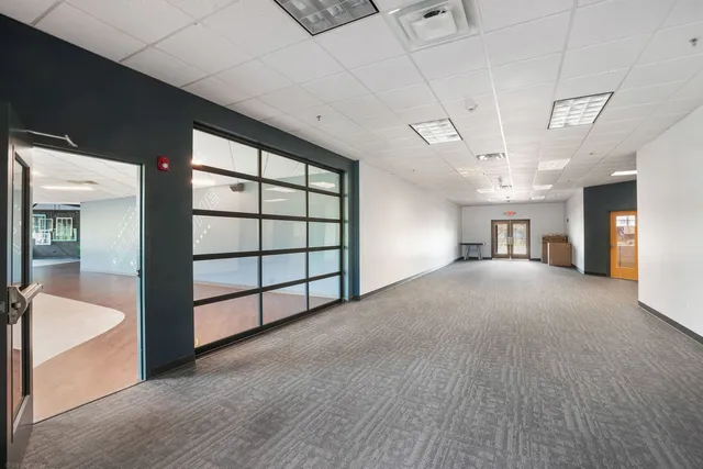 a view of empty room with windows
