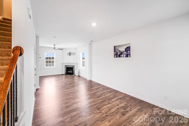 a view of livingroom with hardwood floor and a fireplace