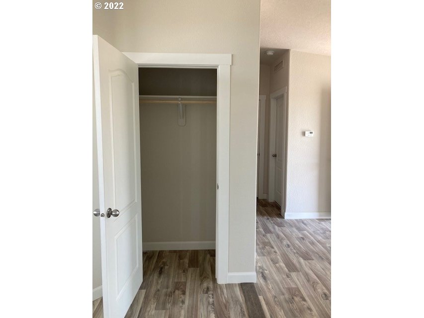 3104 Southwest Terrace Drive Pendleton, OR 97801 - Photo 12 of 18 a view of a hallway with wooden floor