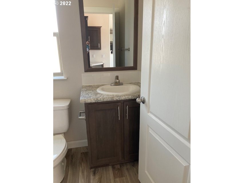 3104 Southwest Terrace Drive Pendleton, OR 97801 - Photo 17 of 18 a bathroom with a sink and a mirror