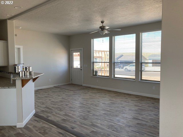 3104 Southwest Terrace Drive Pendleton, OR 97801 - Photo 2 of 18 a view of an empty room with a window and wooden floor
