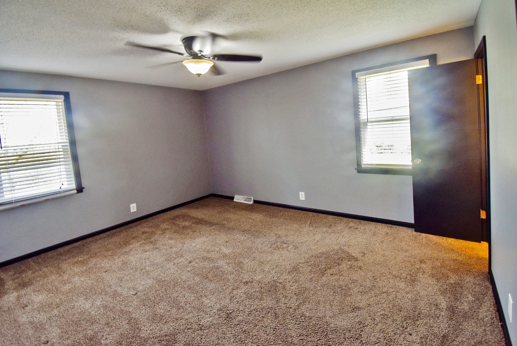 710 Dean Road Clarksville, TN 37040 - Photo 12 of 17 an empty room with windows and fan