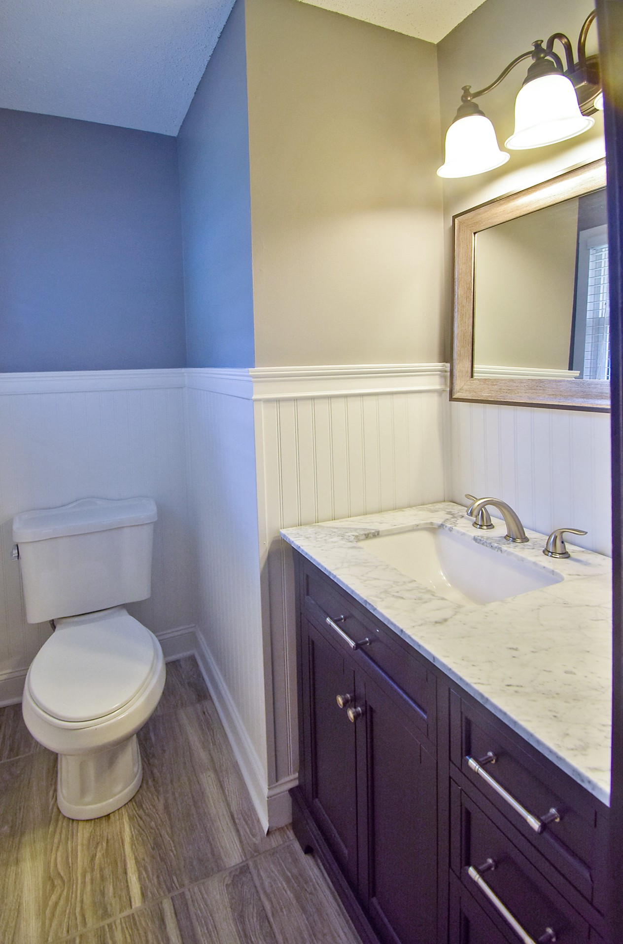 710 Dean Road Clarksville, TN 37040 - Photo 14 of 17 a bathroom with a granite countertop toilet sink and a mirror
