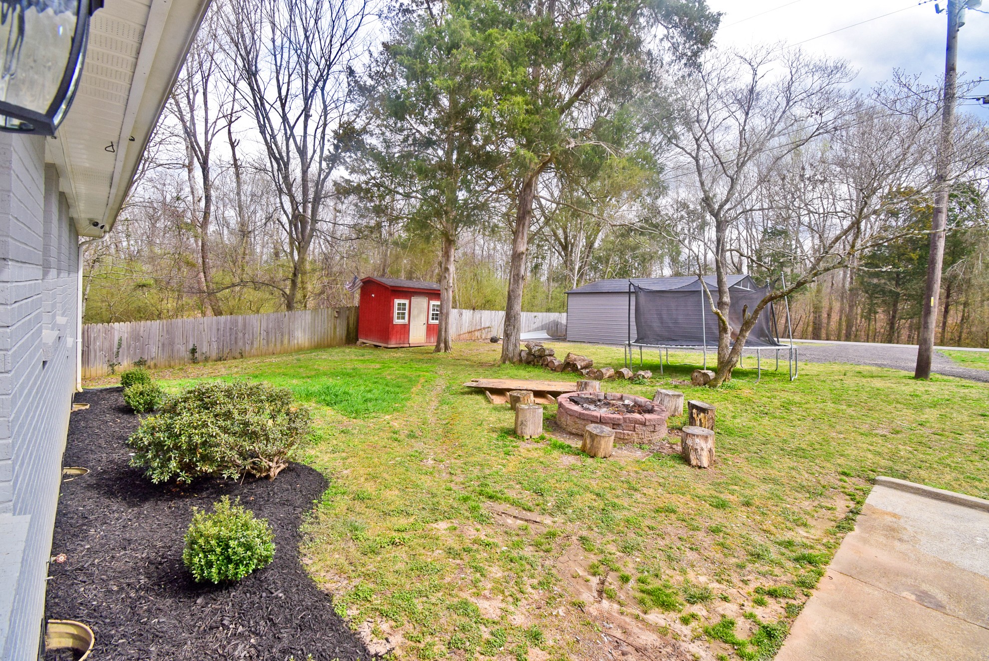 710 Dean Road Clarksville, TN 37040 - Photo 15 of 17 a view of a backyard with table and chairs and a fire pit