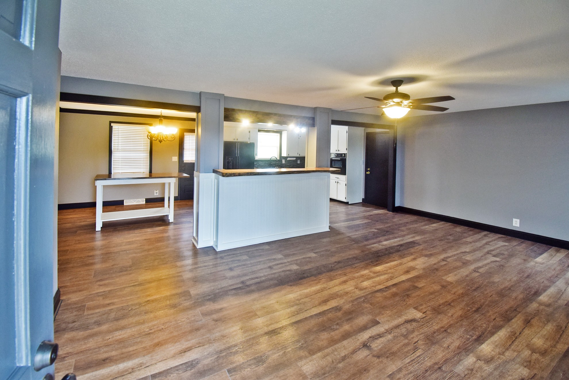 710 Dean Road Clarksville, TN 37040 - Photo 3 of 17 a view of an empty room with window and wooden floor