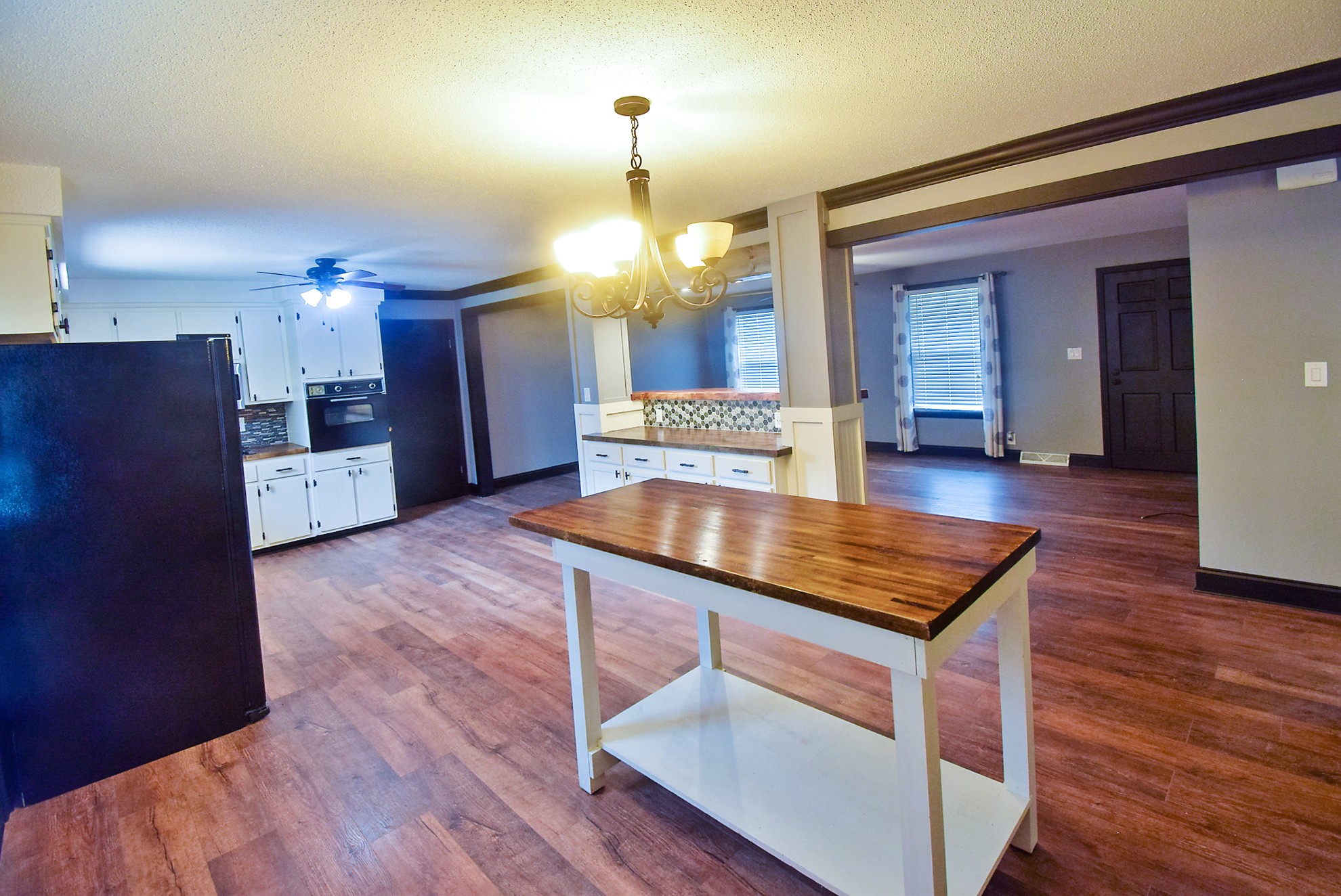 710 Dean Road Clarksville, TN 37040 - Photo 5 of 17 a room with wooden floors table and chairs