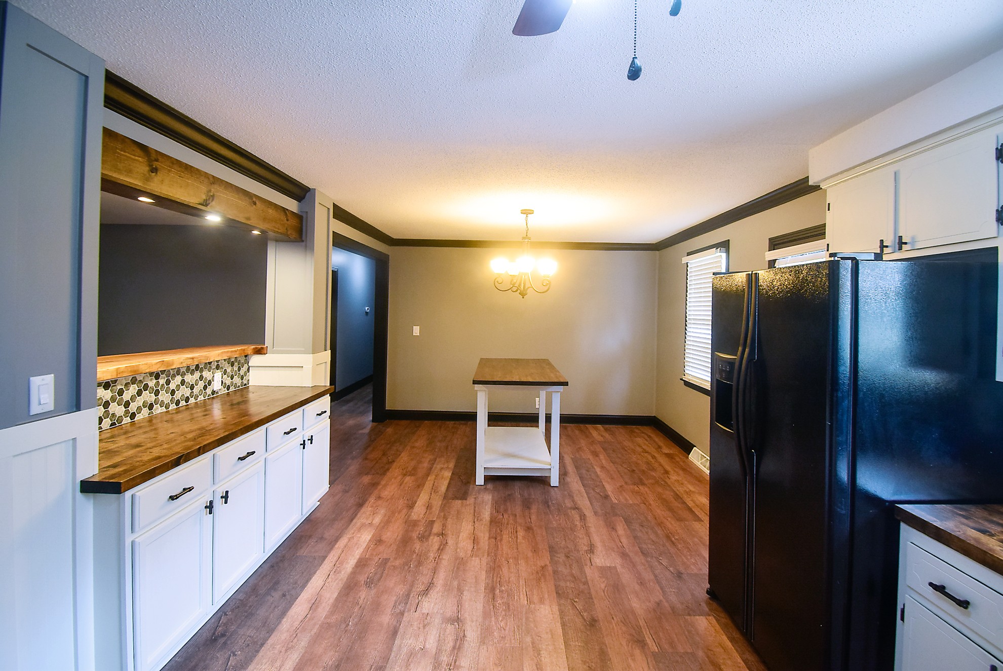710 Dean Road Clarksville, TN 37040 - Photo 6 of 17 a kitchen with granite countertop a refrigerator a sink and wooden floors