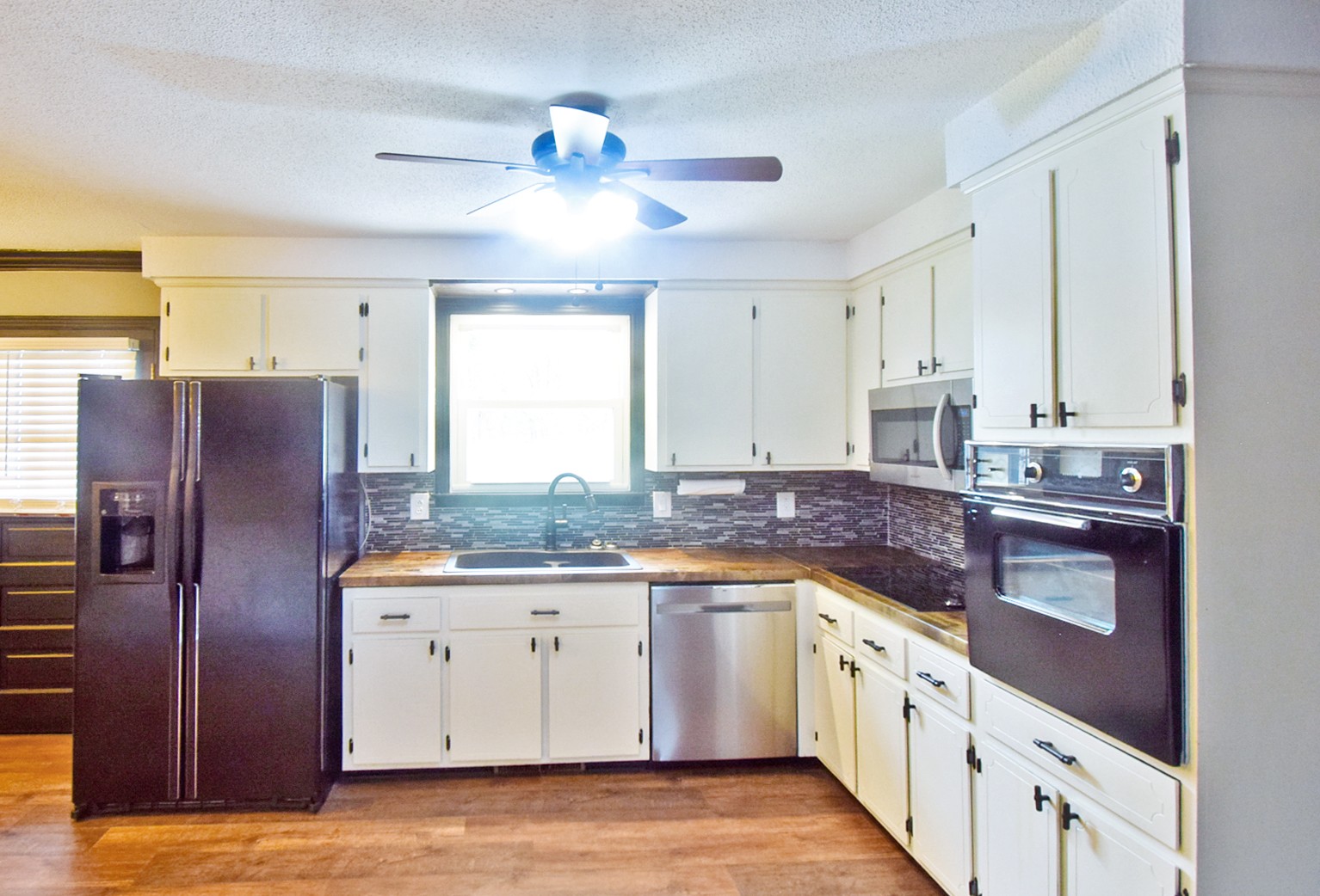 710 Dean Road Clarksville, TN 37040 - Photo 7 of 17 a kitchen with stainless steel appliances granite countertop a sink and cabinets