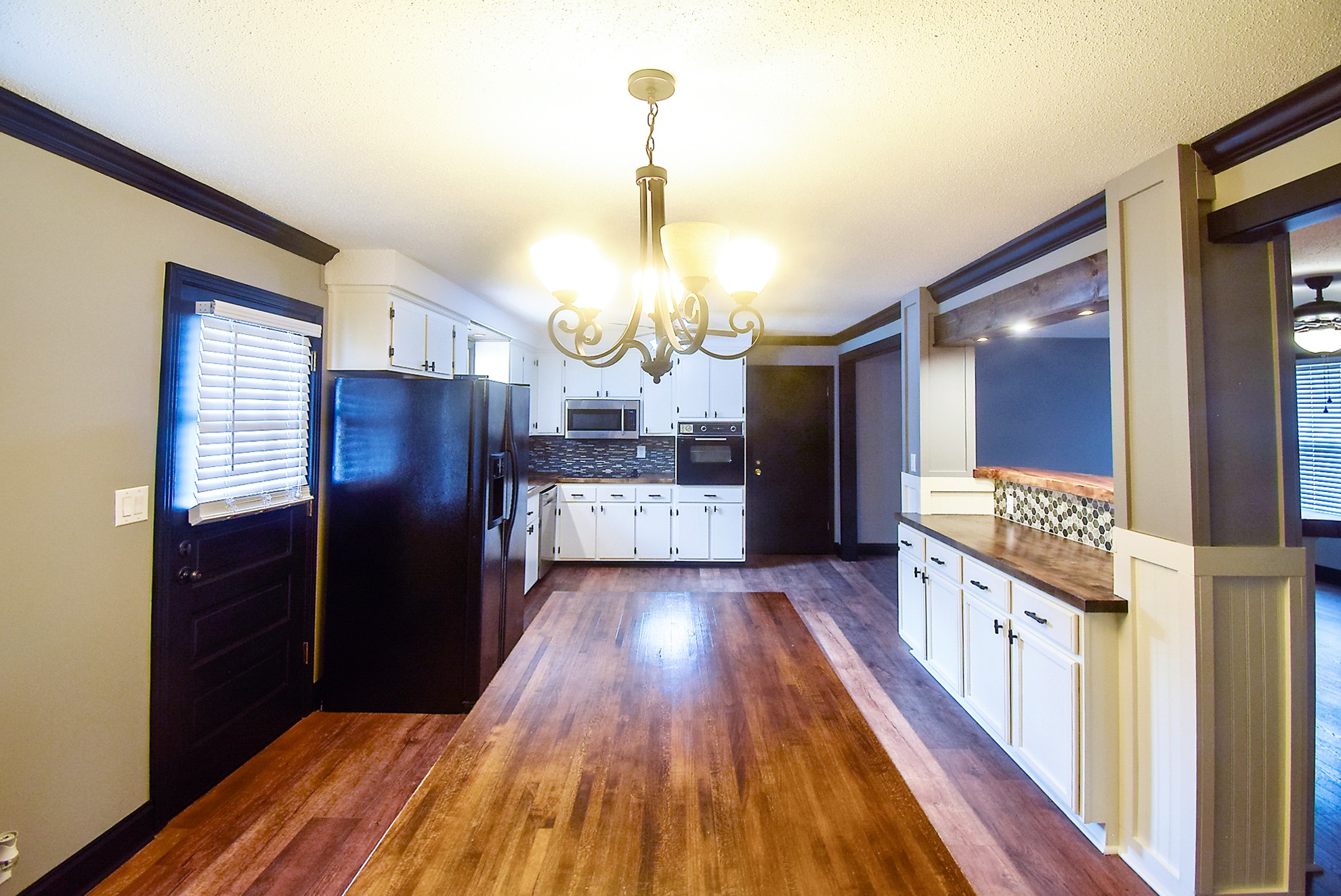 710 Dean Road Clarksville, TN 37040 - Photo 8 of 17 a kitchen with granite countertop wooden floor and stainless steel appliances
