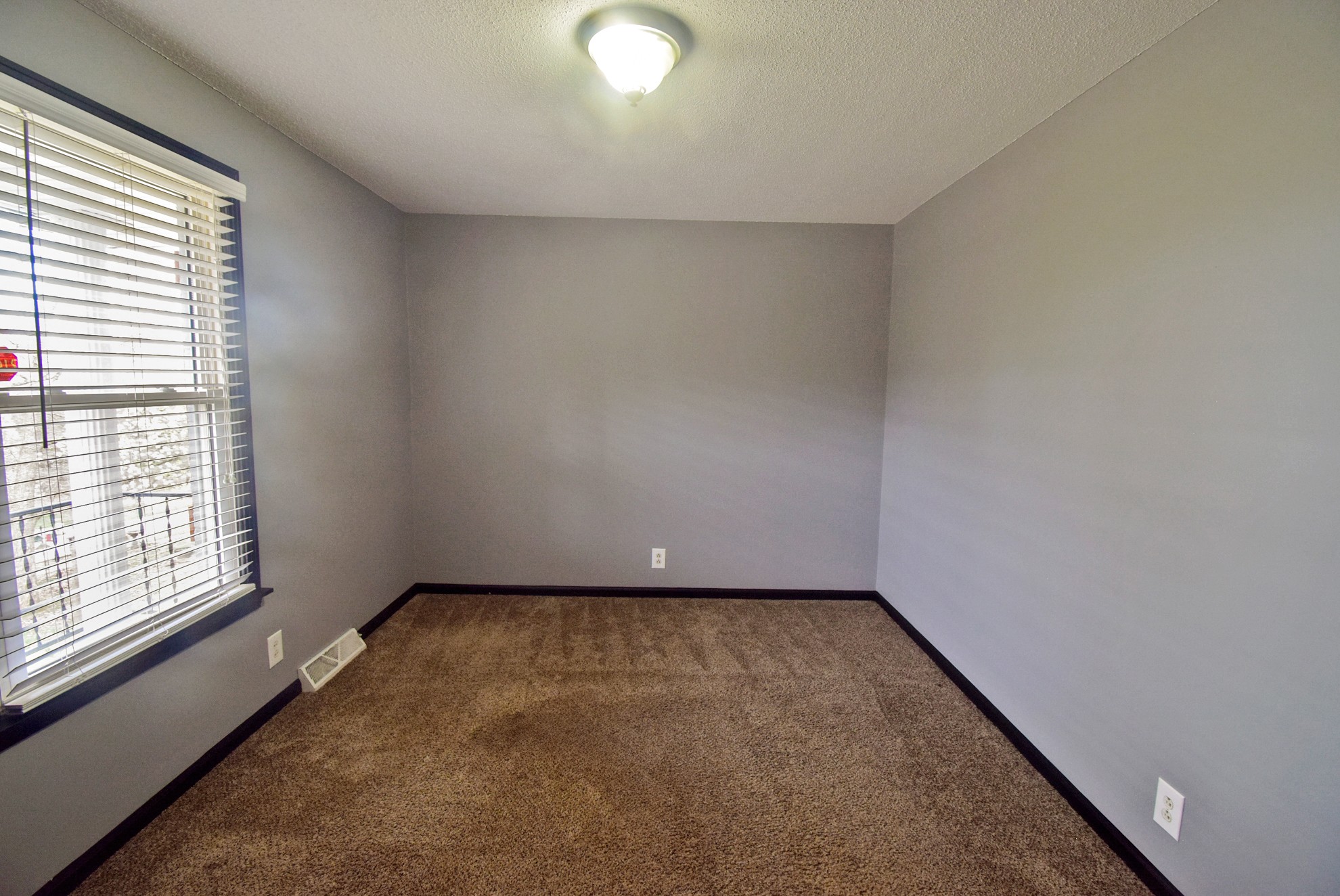 710 Dean Road Clarksville, TN 37040 - Photo 9 of 17 a view of an empty room with a window